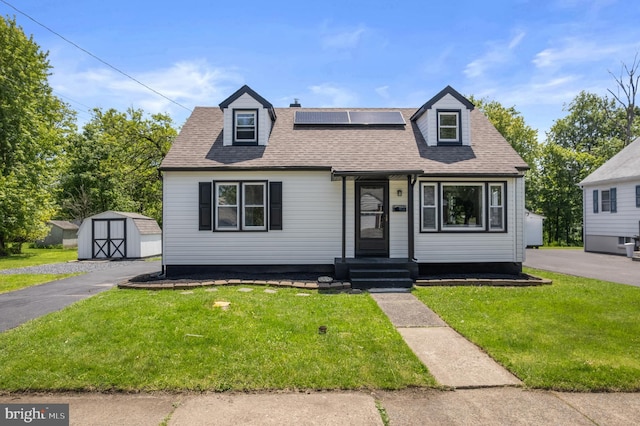 1224 W Mill St, Quakertown, PA 18951 - view of front of house with a front yard, roof mounted solar panels, and a shingled roof