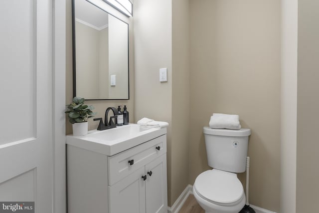 1224 W Mill St, Quakertown, PA 18951 - half bath with vanity, toilet, baseboards, and ornamental molding