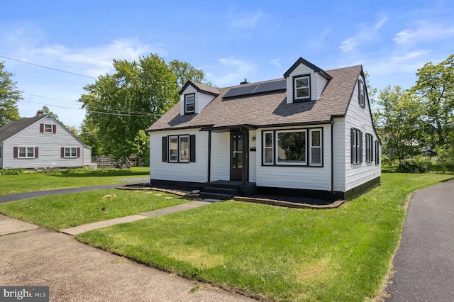 1224 W Mill St, Quakertown, PA 18951 - cape cod-style house featuring roof mounted solar panels, roof with shingles, and a front yard