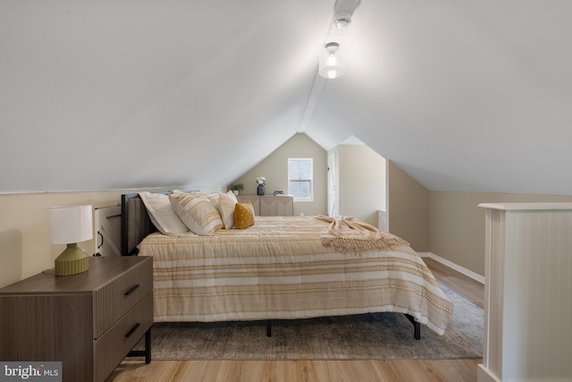 1224 W Mill St, Quakertown, PA 18951 - bedroom with wood finished floors, lofted ceiling, and baseboards