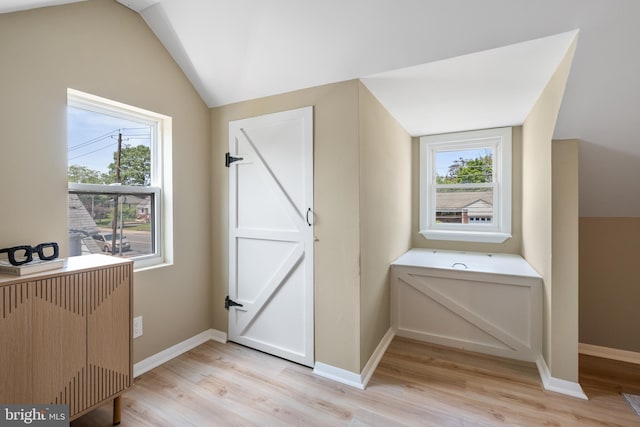 1224 W Mill St, Quakertown, PA 18951 - bathroom featuring healthy amount of natural light, lofted ceiling, wood finished floors, and baseboards