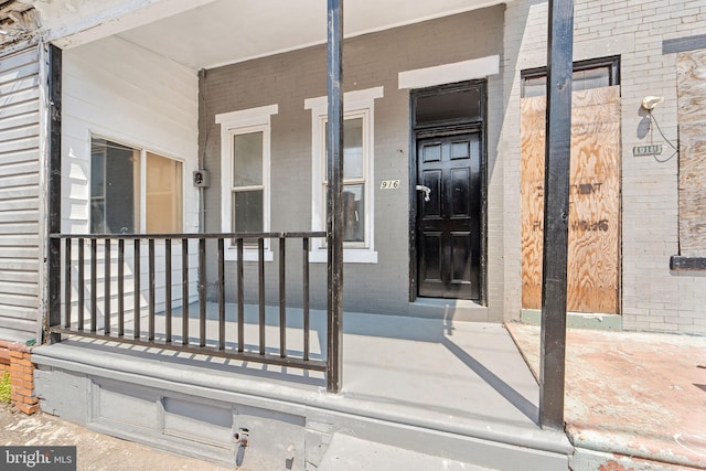 916 S 8th St, Camden, NJ 08102 - entrance to property with covered porch and brick siding