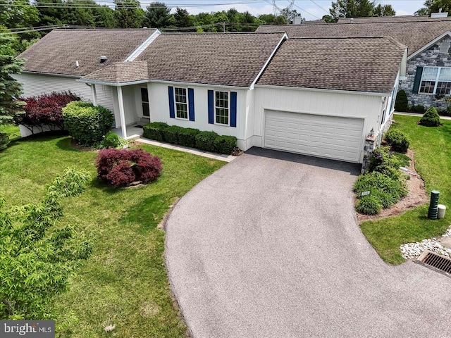916 E Fox Hound Chase Chase, Glen Mills, PA 19342 - ranch-style house featuring asphalt driveway, a garage, a front yard, and roof with shingles