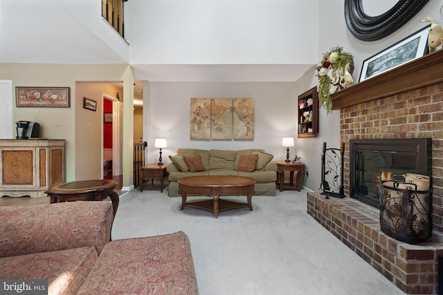 1024 Page Ct, Herndon, VA 20170 - living room with a towering ceiling, carpet floors, a brick fireplace, and baseboards