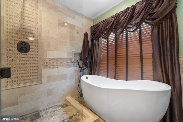 1024 Page Ct, Herndon, VA 20170 - bathroom with tile walls and a freestanding tub