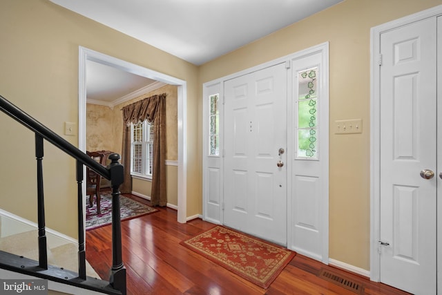 1024 Page Ct, Herndon, VA 20170 - foyer entrance with wood finished floors, baseboards, stairway, and crown molding