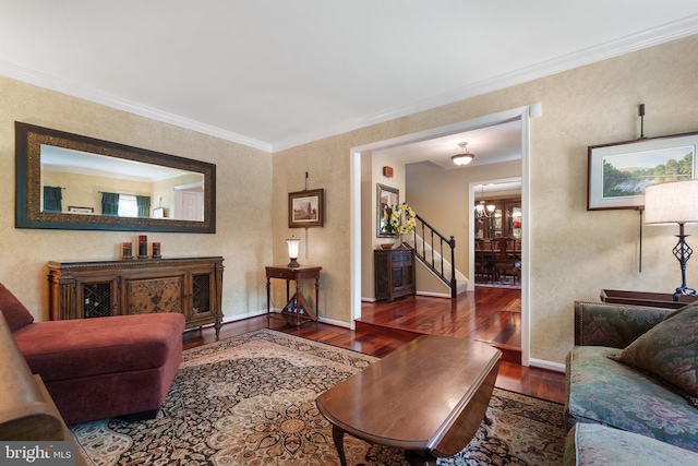 1024 Page Ct, Herndon, VA 20170 - living area with wood finished floors, stairs, baseboards, and crown molding