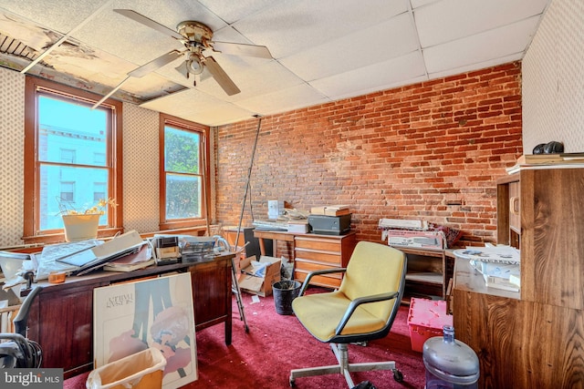 505 N Schroeder St, Baltimore, MD 21223 - carpeted office space featuring a paneled ceiling, a ceiling fan, and brick wall