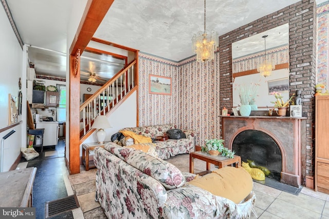 505 N Schroeder St, Baltimore, MD 21223 - living room featuring a chandelier, stairs, and a ceiling fan