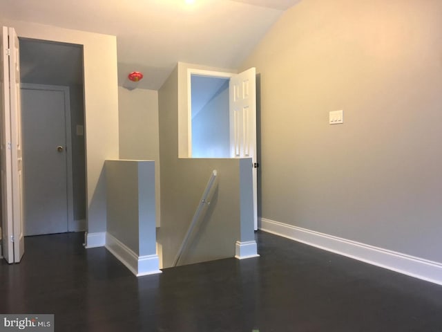 329 S Durham St, Baltimore, MD 21231 - hallway with lofted ceiling, baseboards, an upstairs landing, and dark wood finished floors