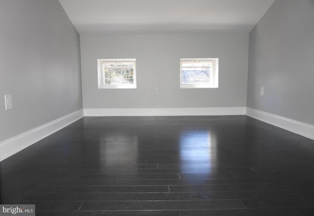 329 S Durham St, Baltimore, MD 21231 - spare room featuring dark wood-style floors and baseboards