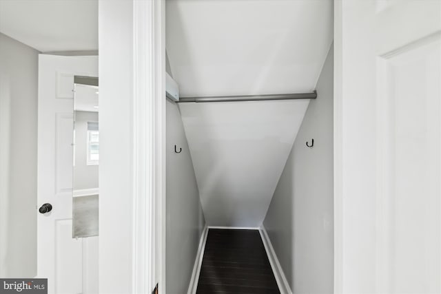 329 S Durham St, Baltimore, MD 21231 - stairway featuring baseboards, wood finished floors, and lofted ceiling