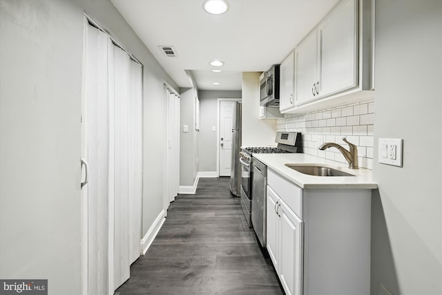329 S Durham St, Baltimore, MD 21231 - kitchen featuring stainless steel appliances, a sink, recessed lighting, white cabinets, and light countertops