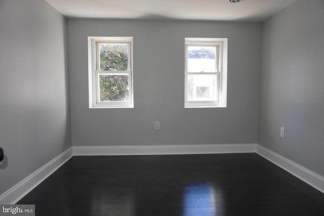 329 S Durham St, Baltimore, MD 21231 - unfurnished room with dark wood finished floors and baseboards