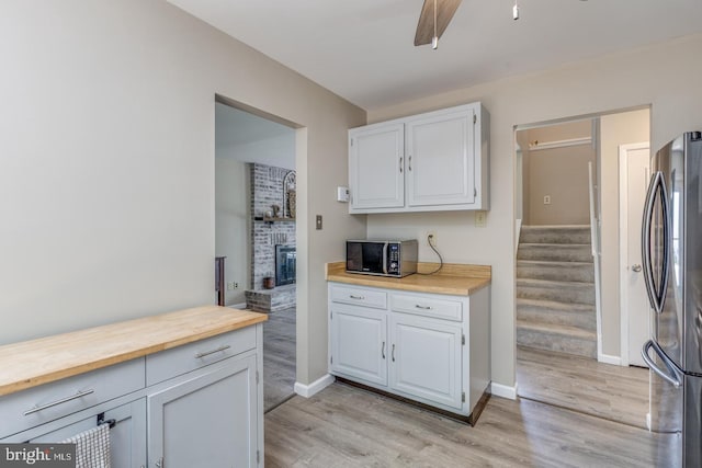 139 Shreve St, Mount Holly, NJ 08060 - kitchen with freestanding refrigerator, light wood-type flooring, butcher block counters, baseboards, and ceiling fan