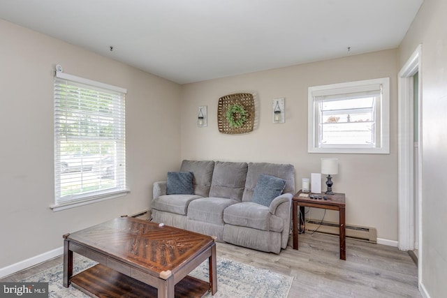 139 Shreve St, Mount Holly, NJ 08060 - living area featuring a baseboard radiator, plenty of natural light, light wood-style flooring, and baseboards