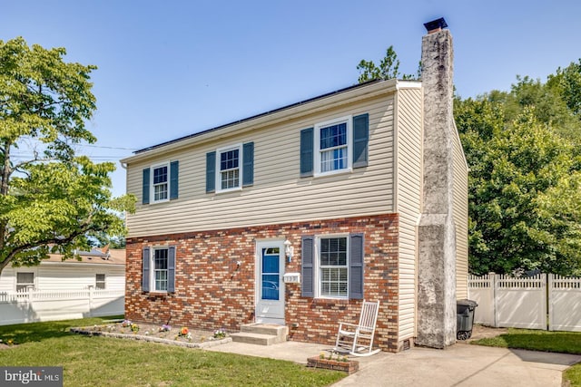 139 Shreve St, Mount Holly, NJ 08060 - colonial-style house with a chimney, brick siding, and entry steps