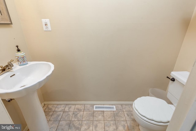 139 Shreve St, Mount Holly, NJ 08060 - half bathroom with toilet, baseboards, and tile patterned flooring