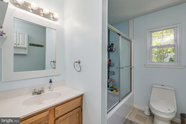 139 Shreve St, Mount Holly, NJ 08060 - bathroom featuring vanity, toilet, shower / bath combination with glass door, and baseboards