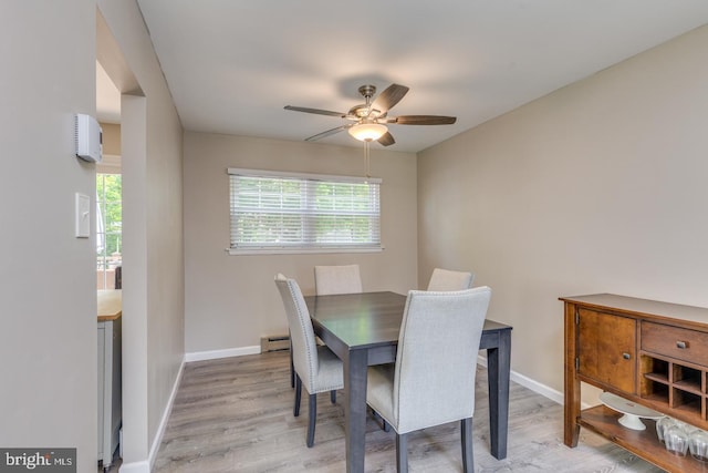 139 Shreve St, Mount Holly, NJ 08060 - dining room featuring ceiling fan, light wood-style floors, baseboard heating, and baseboards