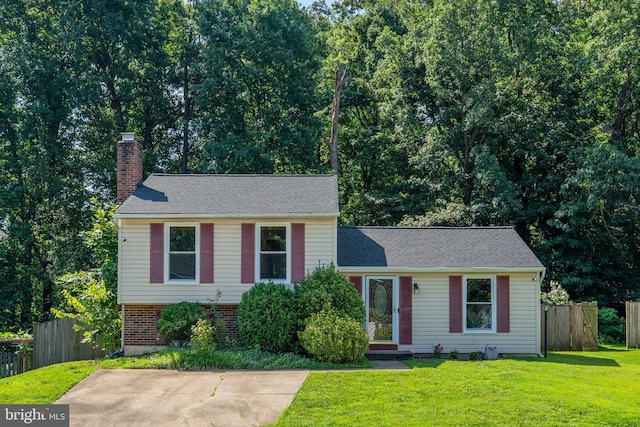 7627 Fallswood Way, Lorton, VA 22079 - tri-level home with a chimney and brick siding