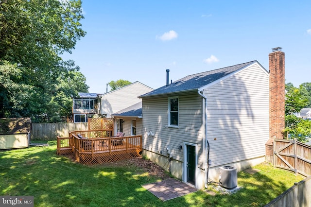 7627 Fallswood Way, Lorton, VA 22079 - back of house with a fenced backyard, a wooden deck, a storage shed, a chimney, and roof with shingles
