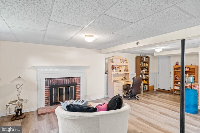 7627 Fallswood Way, Lorton, VA 22079 - living area featuring wood finished floors and a brick fireplace