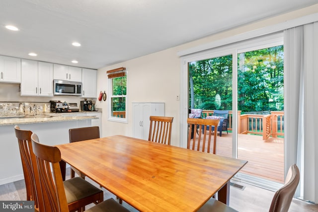 7627 Fallswood Way, Lorton, VA 22079 - dining space with recessed lighting and light wood-type flooring