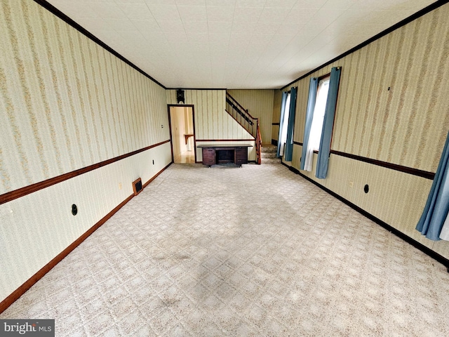 33 N Washington St, Cleona, PA 17042 - unfurnished living room featuring wallpapered walls, ornamental molding, and stairway