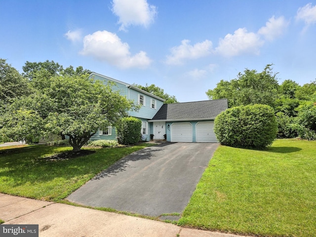 111 Elm Tree Ln, Sterling, VA 20164 - view of front facade with an attached garage, asphalt driveway, a front yard, and a shingled roof