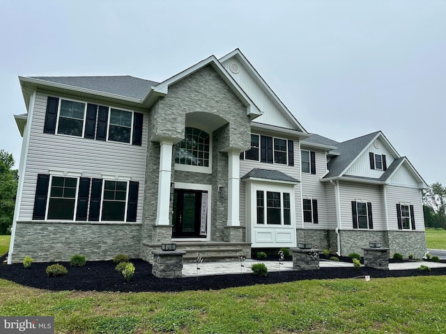 9 Gregory Ct, Monroe Township, NJ 08831 - view of front of home featuring stone siding, board and batten siding, and a front lawn