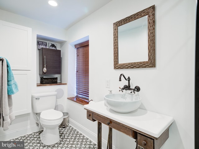 1510 N Leithgow St, Philadelphia, PA 19122 - bathroom featuring a sink, toilet, baseboards, tile patterned flooring, and recessed lighting