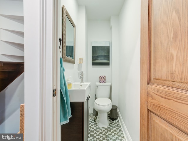 1510 N Leithgow St, Philadelphia, PA 19122 - bathroom featuring toilet, tile patterned flooring, baseboards, and a sink