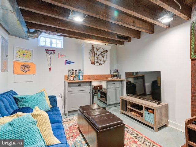 1510 N Leithgow St, Philadelphia, PA 19122 - living room featuring a dry bar, beamed ceiling, and concrete flooring