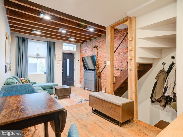 1510 N Leithgow St, Philadelphia, PA 19122 - living area with brick wall, beam ceiling, and wood finished floors