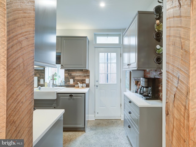 1510 N Leithgow St, Philadelphia, PA 19122 - kitchen featuring gray cabinets, light countertops, backsplash, and dark speckled floor