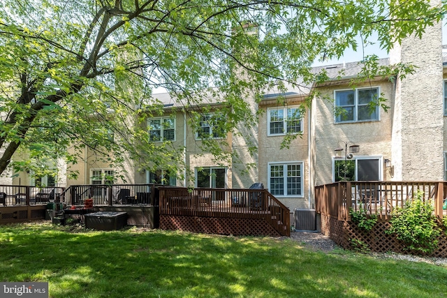 1993 Ryans Run, Lansdale, PA 19446 - back of property featuring a wooden deck, stucco siding, and a lawn