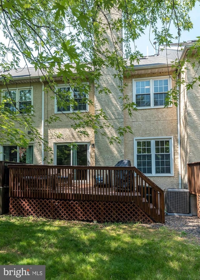 1993 Ryans Run, Lansdale, PA 19446 - back of house featuring stucco siding, cooling unit, a deck, and a yard