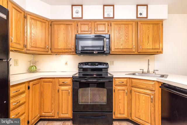 1993 Ryans Run, Lansdale, PA 19446 - kitchen with black appliances, a sink, light countertops, and brown cabinetry