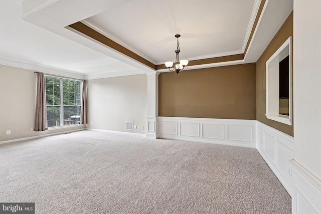 11793 Nates Pl, Woodbridge, VA 22192 - unfurnished room with ornamental molding, a chandelier, a tray ceiling, carpet, and a decorative wall