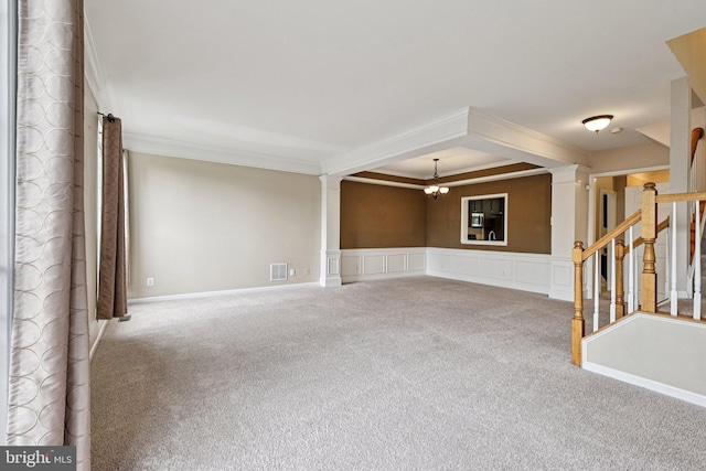 11793 Nates Pl, Woodbridge, VA 22192 - carpeted spare room featuring ornamental molding, decorative columns, a chandelier, stairs, and wainscoting