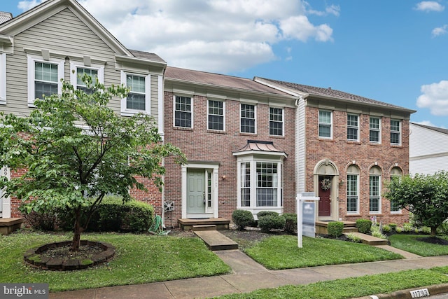 11793 Nates Pl, Woodbridge, VA 22192 - multi unit property with brick siding and a front lawn