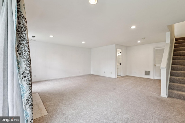 11793 Nates Pl, Woodbridge, VA 22192 - below grade area with light colored carpet, stairs, and recessed lighting