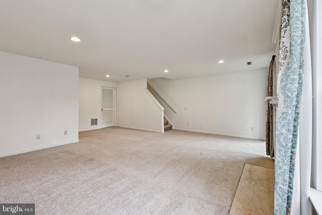 11793 Nates Pl, Woodbridge, VA 22192 - unfurnished living room featuring light carpet, recessed lighting, and stairs