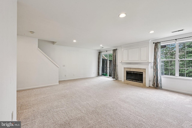 11793 Nates Pl, Woodbridge, VA 22192 - unfurnished living room with a fireplace, light colored carpet, and recessed lighting