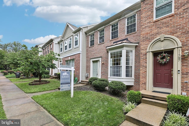 11793 Nates Pl, Woodbridge, VA 22192 - townhome / multi-family property with brick siding