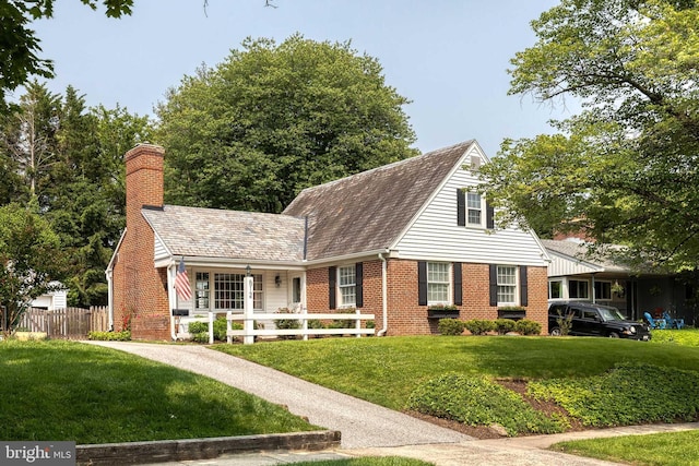 512 Piccadilly Rd, Baltimore, MD 21204 - new england style home with brick siding and a chimney