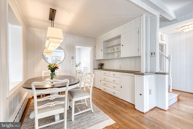 512 Piccadilly Rd, Baltimore, MD 21204 - dining room featuring a baseboard radiator and light wood-style flooring