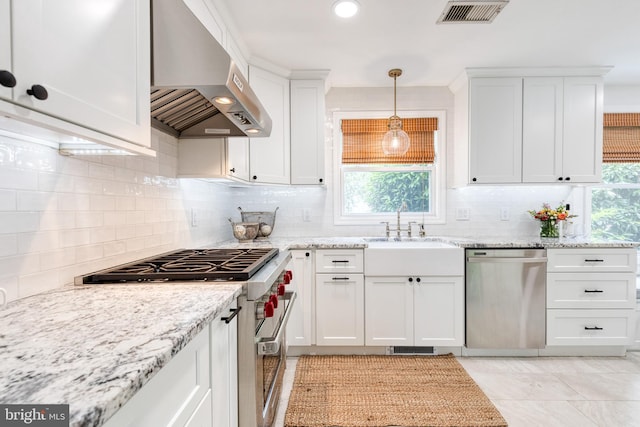 512 Piccadilly Rd, Baltimore, MD 21204 - kitchen with range hood, appliances with stainless steel finishes, white cabinets, decorative backsplash, and light stone countertops