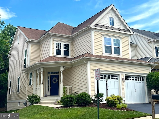 9807 Amsterdam St, Lorton, VA 22079 - victorian-style house with an attached garage, asphalt driveway, and a front yard